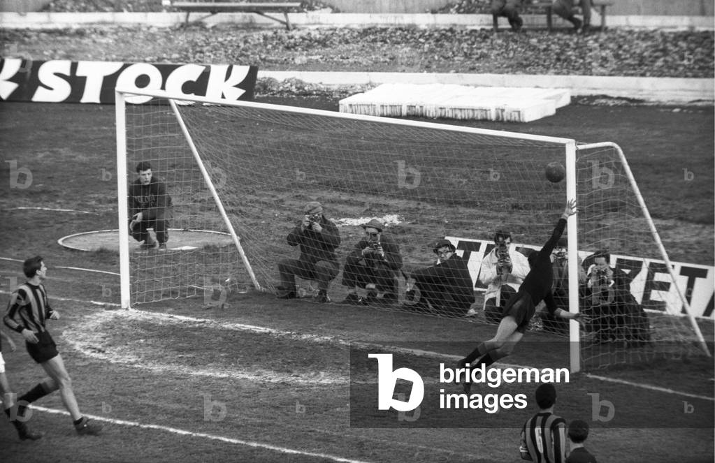Armando Picchi, Giuliano Sarti and Giacinto Facchetti looking at an attacking shot, Bologna, Italy
