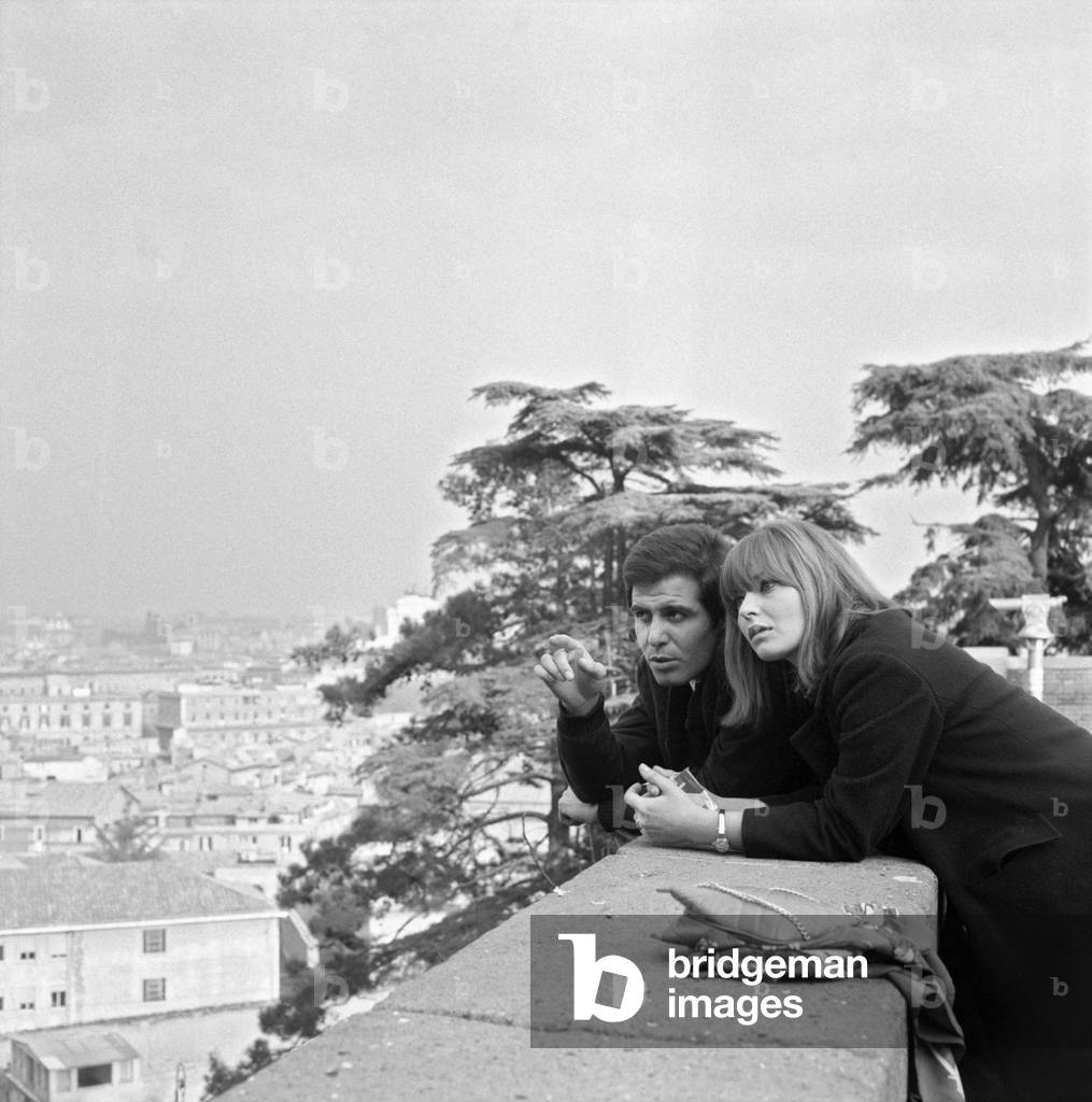 A young man showing something to a young woman, Rome, Italy