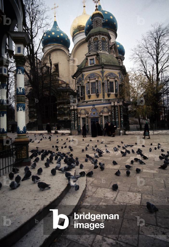 Two monks and some worshipers outside the Chapel-at-the-Well in Sergiyev Posad's monastery, Zagorsk, Russian Federation