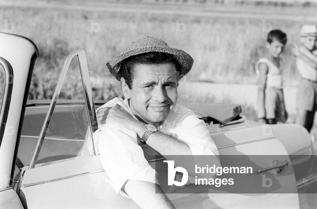 Enzo Tortora looking perplexed sitting in a Cabriolet car