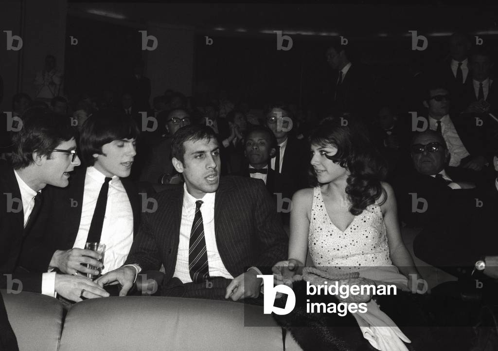Adriano Celentano is sat in the stalls with Claudia Mori, 1966 (b/w photo)