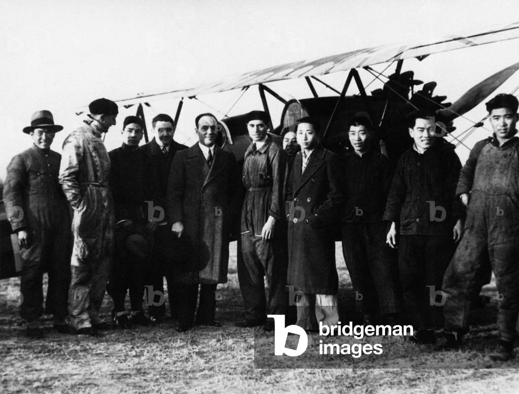 Mario De Bernardi and Torresan in front of a Caproni biplane