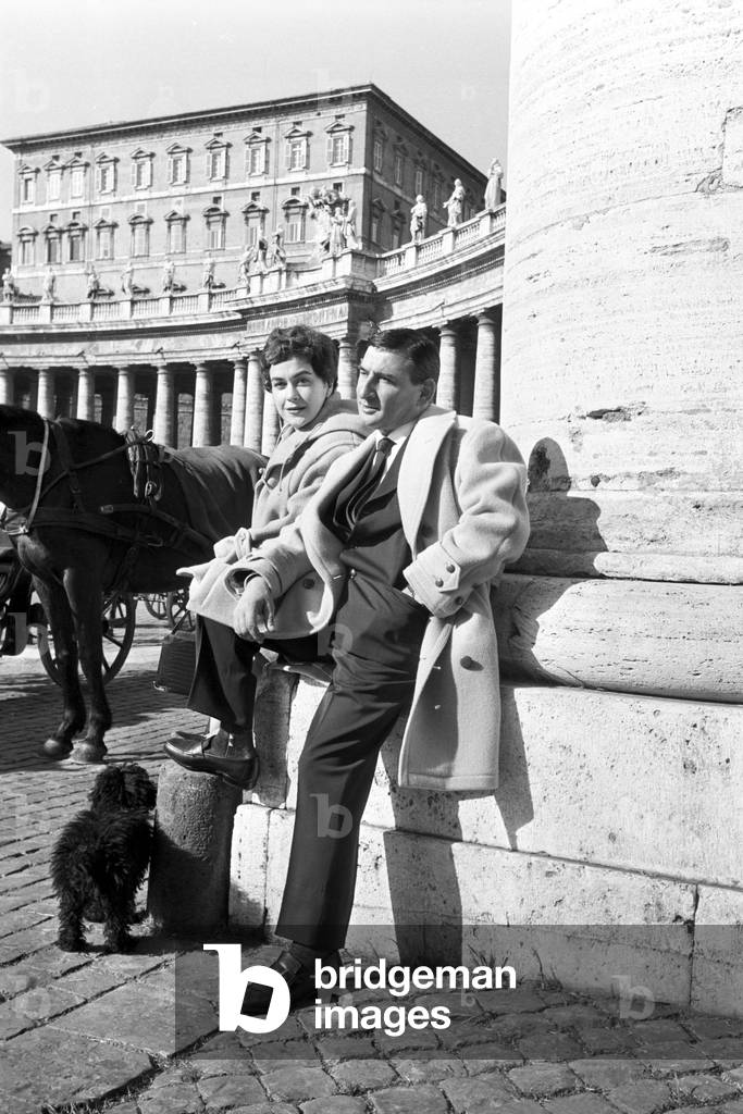Renato Rascel and Huguette Cartier on Saint Peter Square, Italy, 1955 (b/w photo)