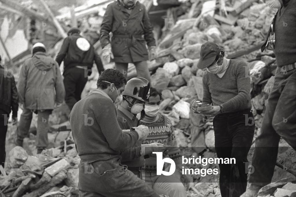 Rescuers at work among the rubble, 1980 (b/w photo)