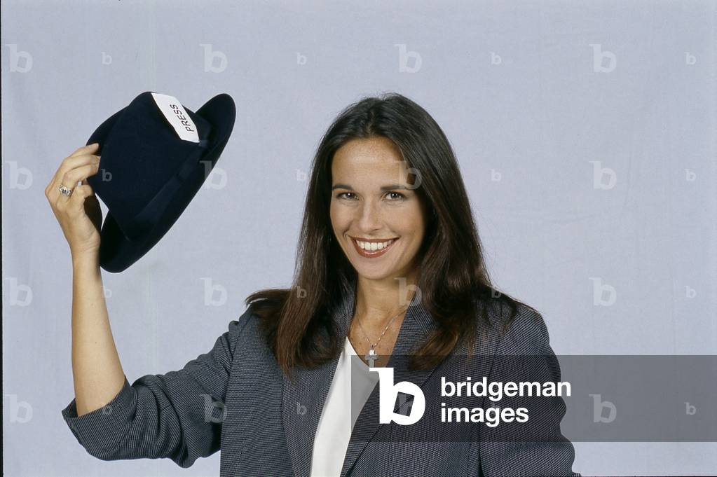 Cristina Parodi holding a hat