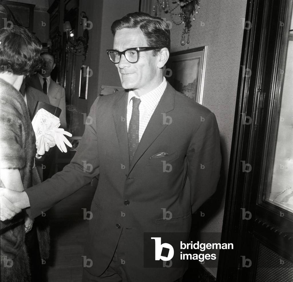 Pier Paolo Pasolini shaking hands, Italy, 1963 (b/w photo)