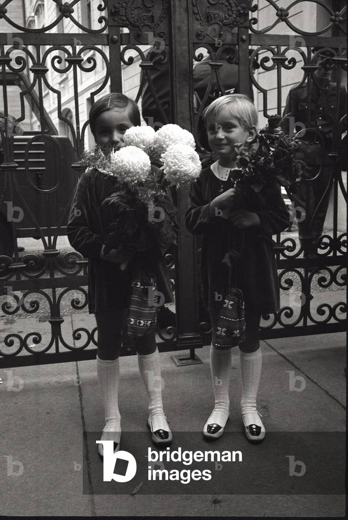 Czeck children hold flowers in their hands for Svoboda