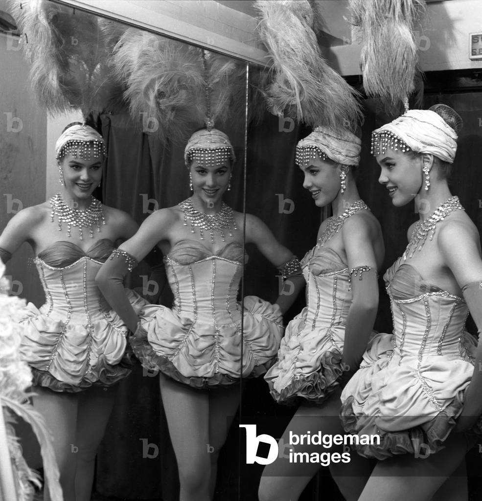 Alice and Ellen Kessler, twin sisters and german artistic duo, posing in the dressing room at the Lido in Paris, France, 1958 (b/w photo)