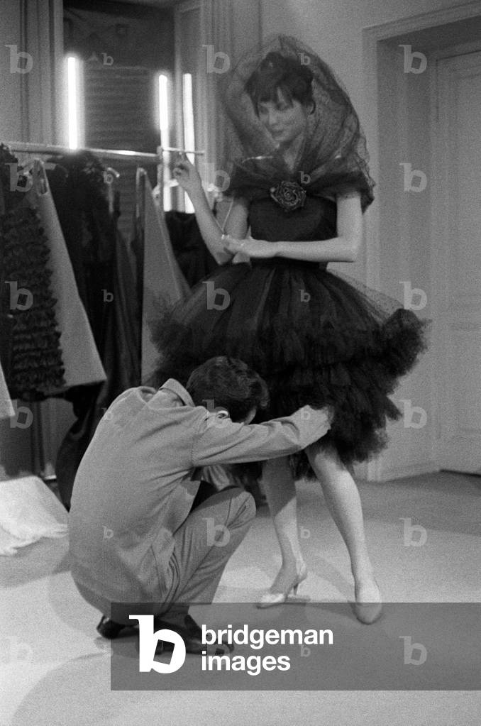 Roberto Capucci adjusting a tulle skirt, Rome, Italy, 1950