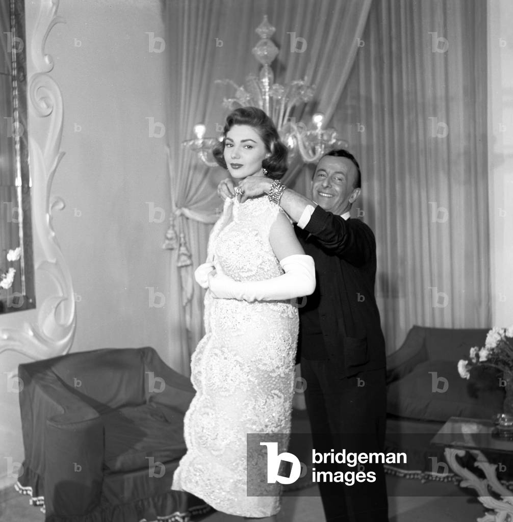 Sylva Koscina and Emilio Federico Schuberth in his fashion house, Italy, 1957 (b/w photo)