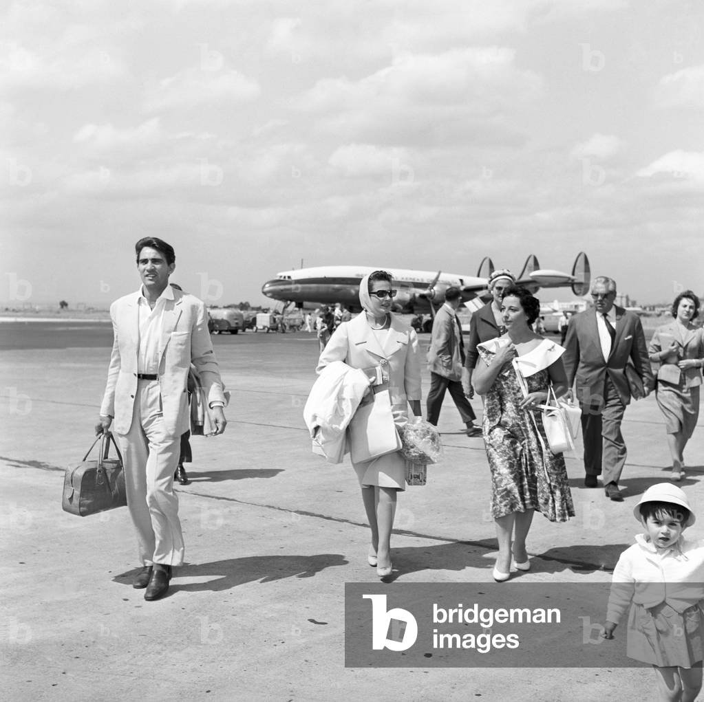Walter Chiari and Carmen Sevilla arriving at Ciampino airport, Italy, 1958 (b/w photo)