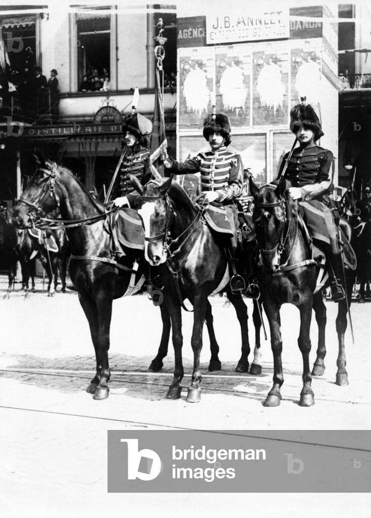 Three Belgian guides on horseback