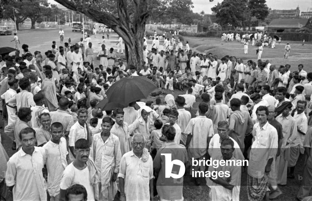 People on the Shaheed Minar Maidan close to the Martyrs' Monument, Kolkata, India, 1962 (b/w photo)