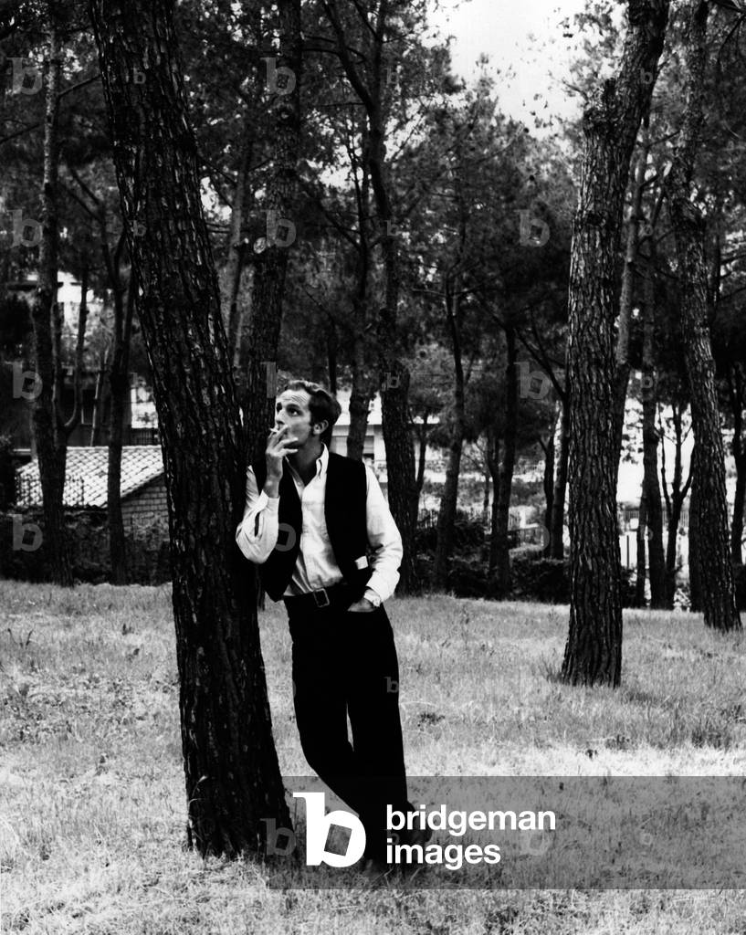 Philippe Leroy smokes in the garden of his villa on the Aurelia's Way
