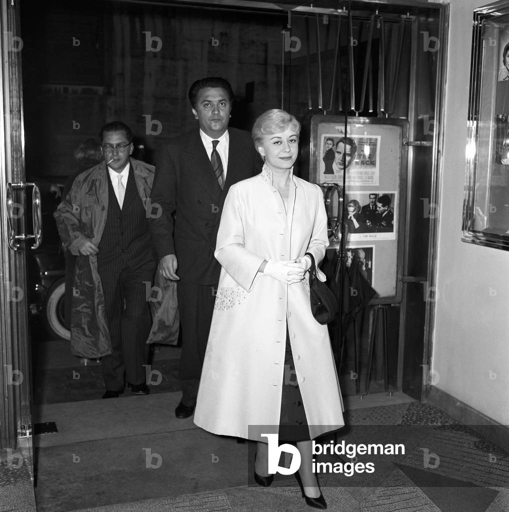 Giulietta Masina and Federico Fellini attending the premiere of the film Juliet of the Spirits, Italy, 1957 (b/w photo)