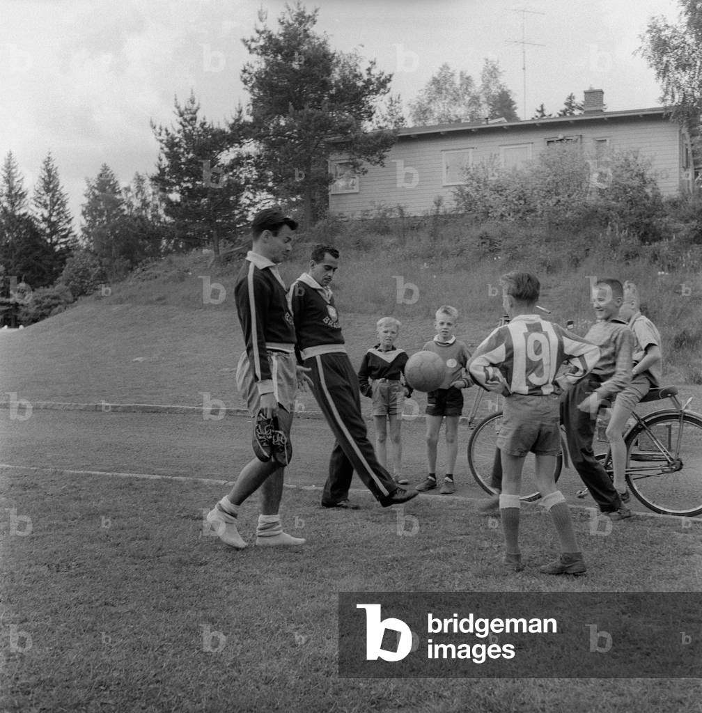 Zito playing with some young boys, Stockholm, Sweden