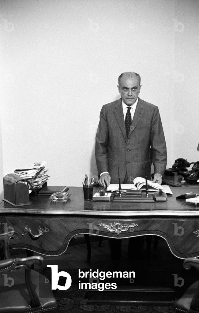 Giorgio Bo behind the desk