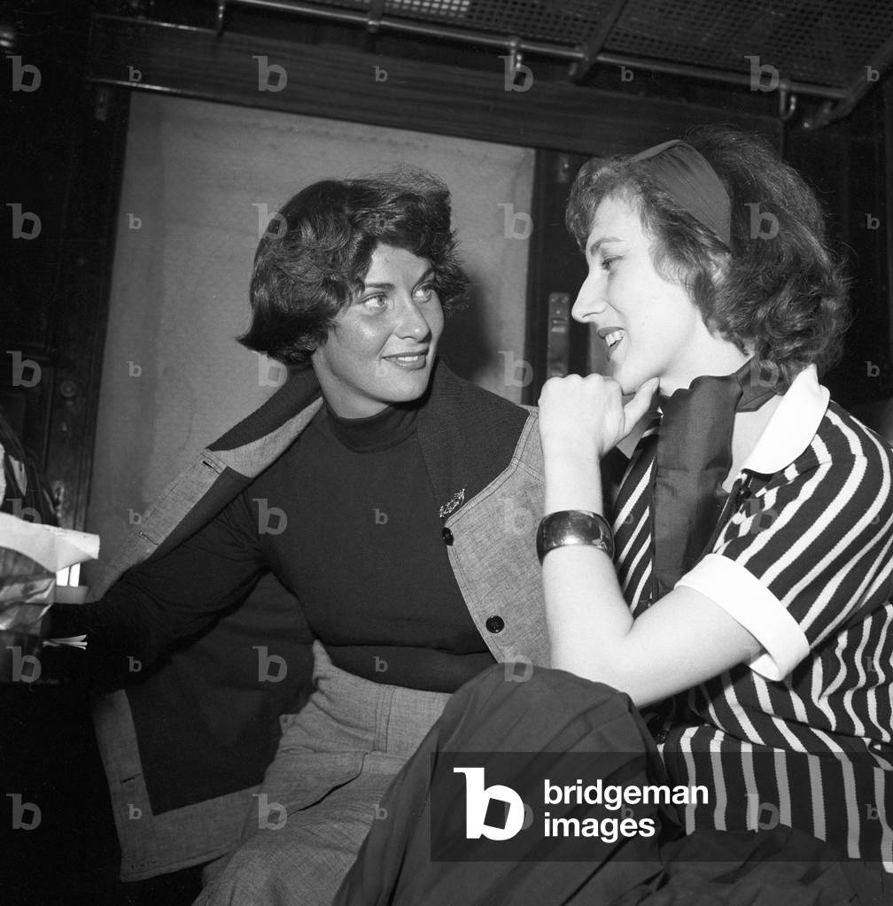 Alida Valli and Valentina Cortese on a train, Italy, 1955 (b/w photo)