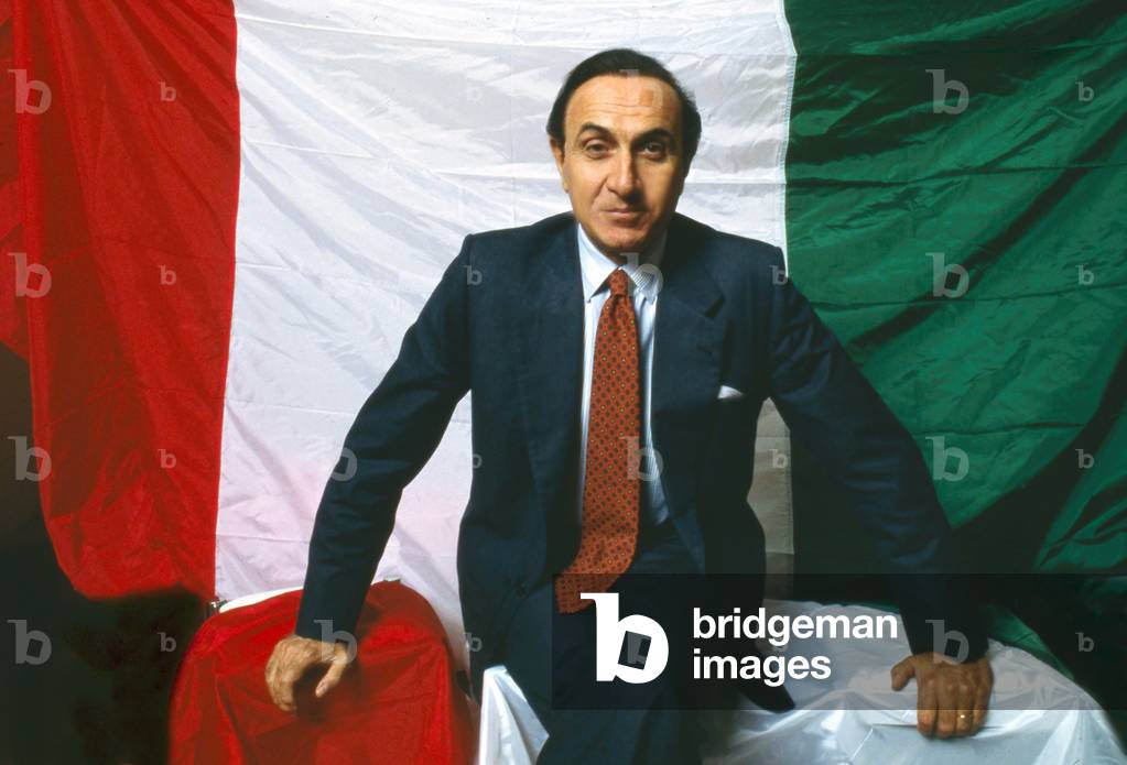 Portrait of Pippo Baudo in front of the Italian flag
