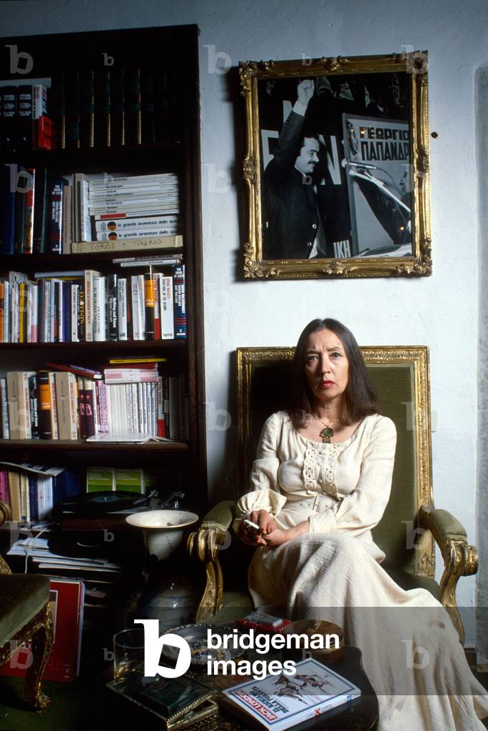 Oriana Fallaci sitting and smoking a cigarette, Greve, Italy