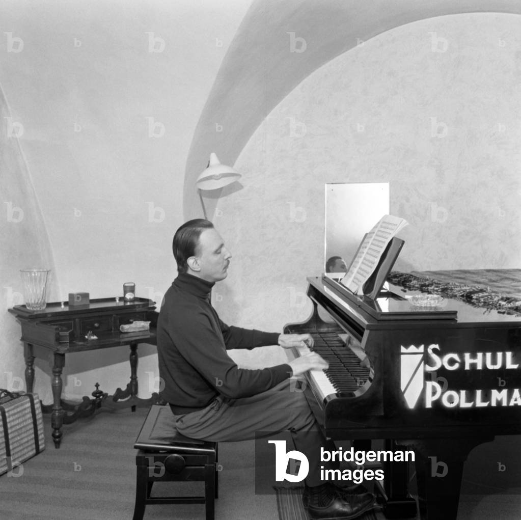 Arturo Benedetti Michelangeli seated at the piano, 1966 (b/w photo)