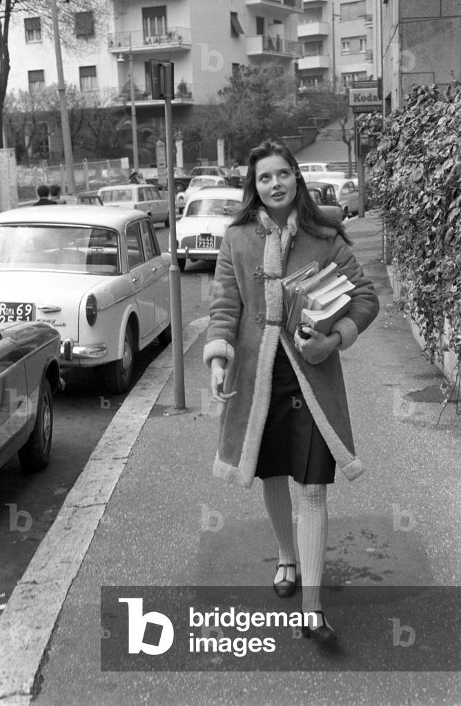 Isabella Rossellini holding some books, Italy, 1974 (b/w photo)