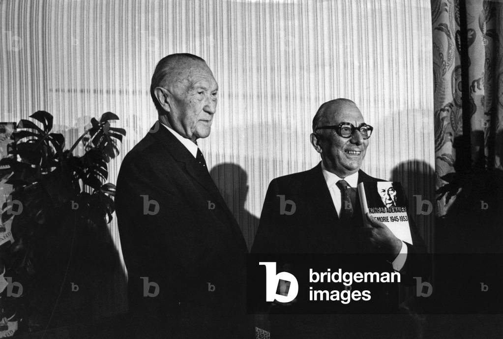 Arnoldo Mondadori showing a copy of Memories 1945-1953 beside Konrad Adenauer, Italy, 1966 (b/w photo)