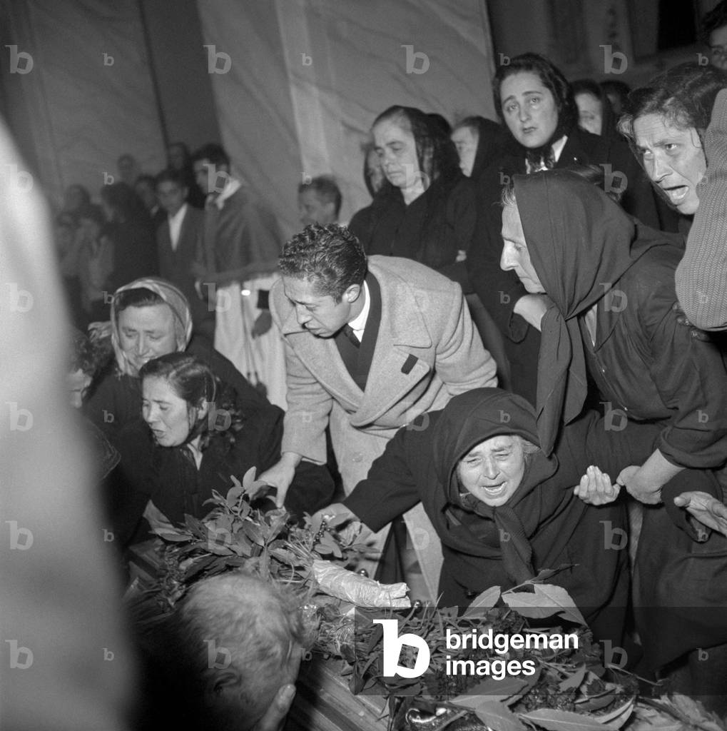 A woman crying at the funeral of the victims of Marcinelle, Manoppello, Italy