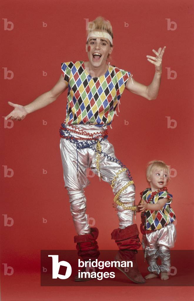 Alberto Camerini and his daughter Valentina posing wearing a Harlequin costume, Italy