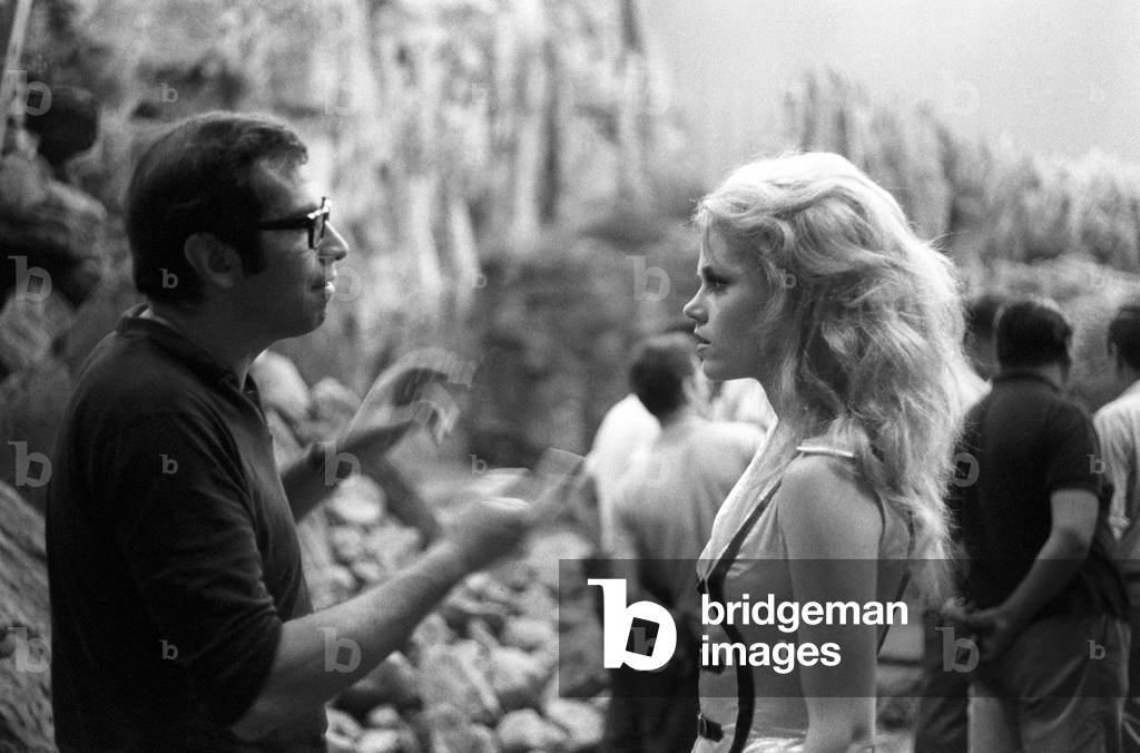 Roger Vadim and Jane Fonda converse on the set of Barbarella