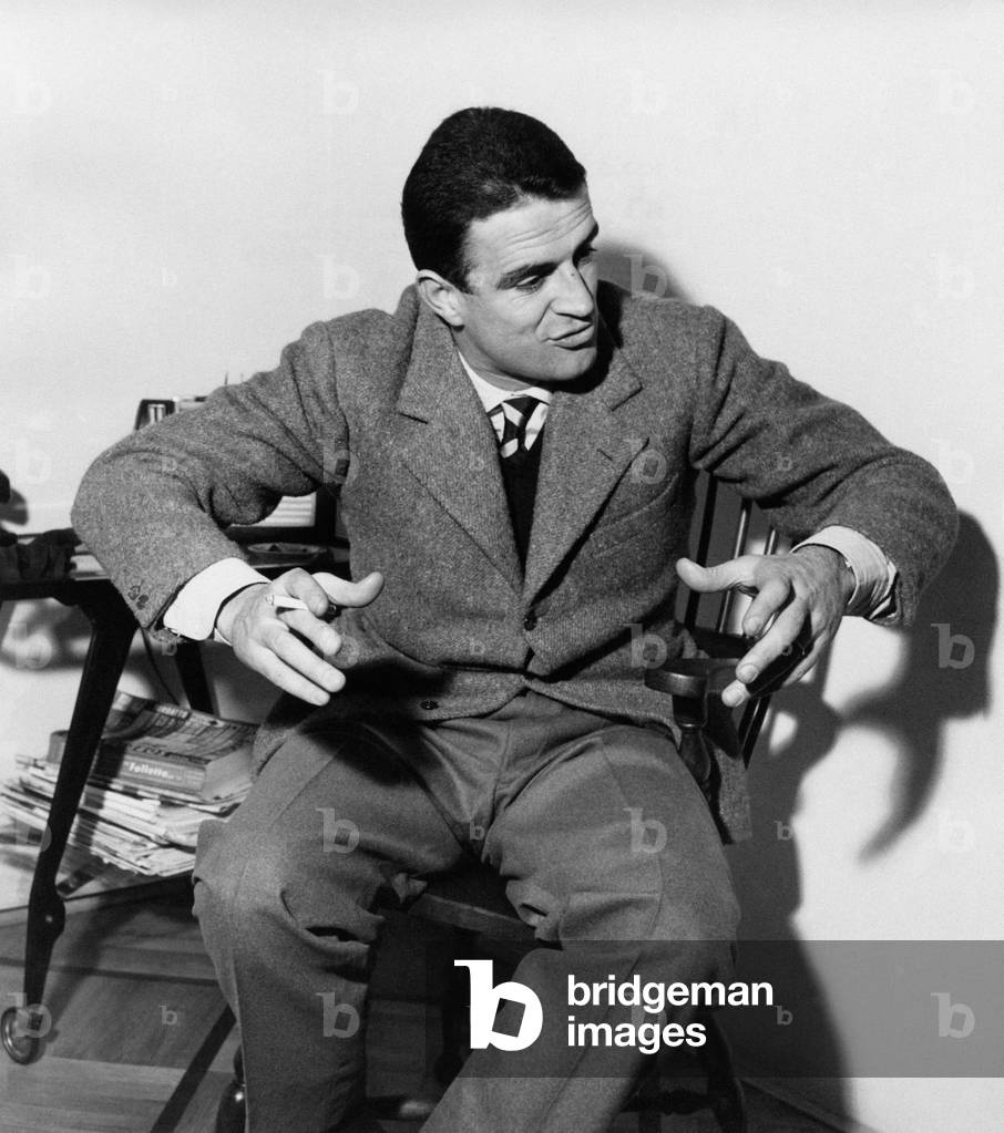 Rino Ferrario gesticulating on a chair