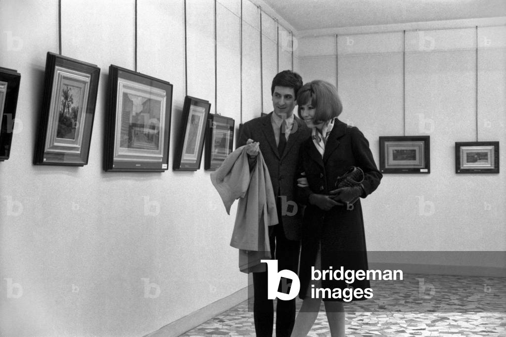 A woman looking at a phone, Italy