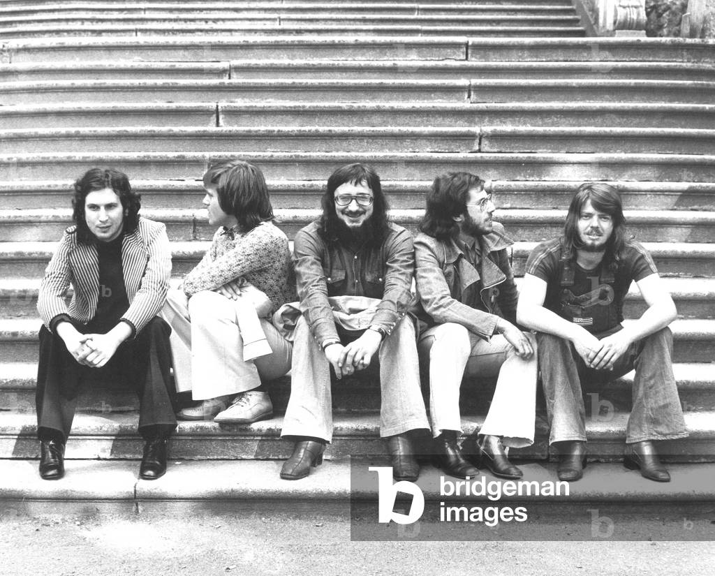 The Nomadi seated on a stairs. From left, Umberto Maggi, Beppe Carletti, Augusto Daolio, Franco Midilli and Paolo Lancellotti