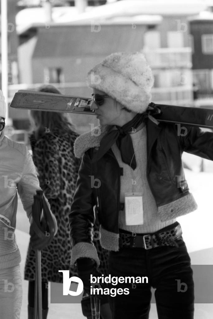 A woman with a pair of skis