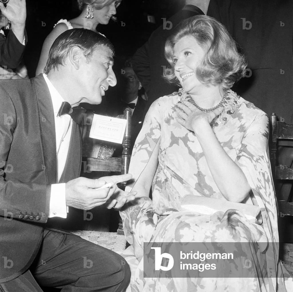 Renato Rascel and Rita Hayworth at a party, Italy, 1957 (b/w photo)