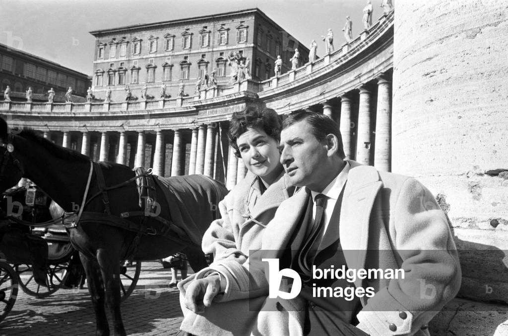 Renato Rascel and Huguette Cartier on Saint Peter Square, Italy, 1955 (b/w photo)