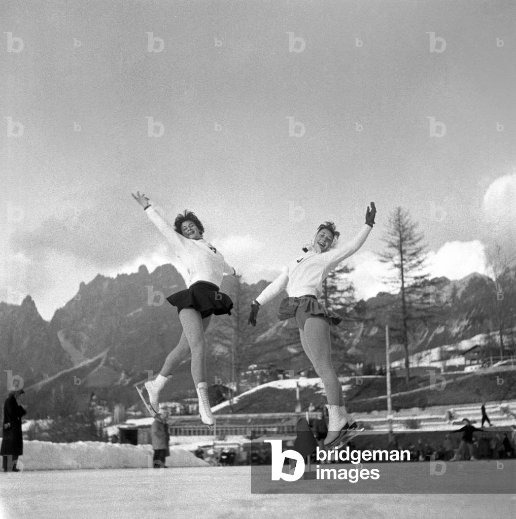 Figure skaters performing, Winter Olympics, Cortina d'Ampezzo, Italy, 1956 (b/w photo)