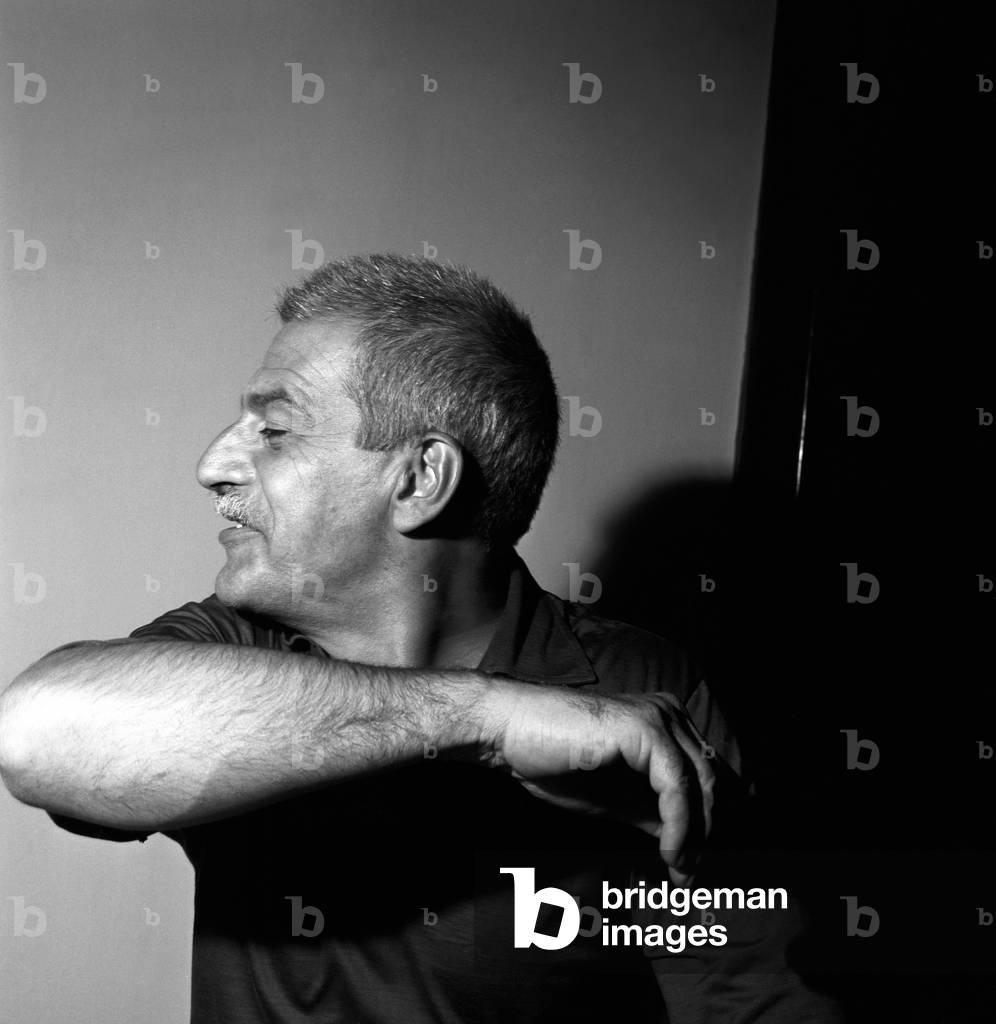 Elio Vittorini joking with a lifted arm