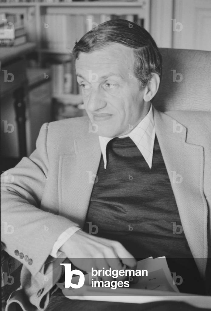 Carlo Fruttero sitting in an armchair, Italy, 1974 (b/w photo)