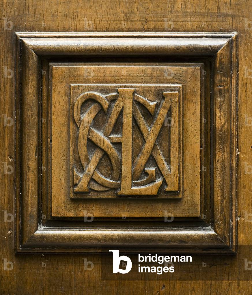 Monogram on a piece of furniture in the current reading room of the Biblioteca Ambrosiana, Milan (photo)