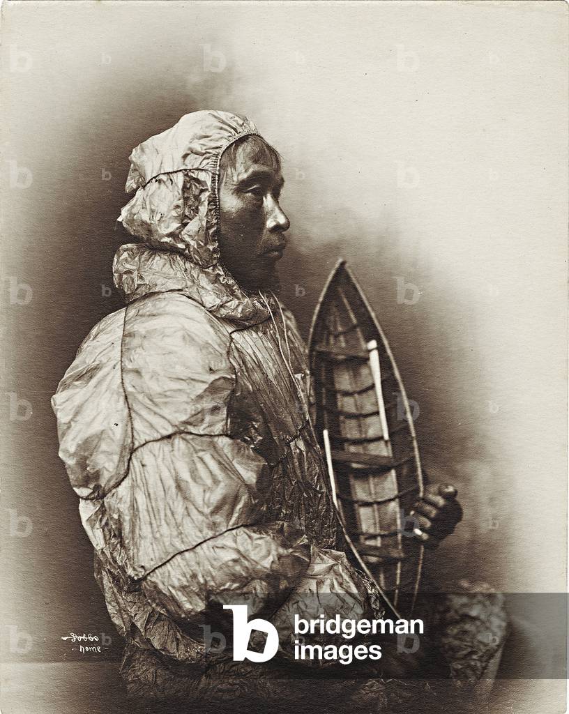 Man with model umiak, Alaska, c.1906