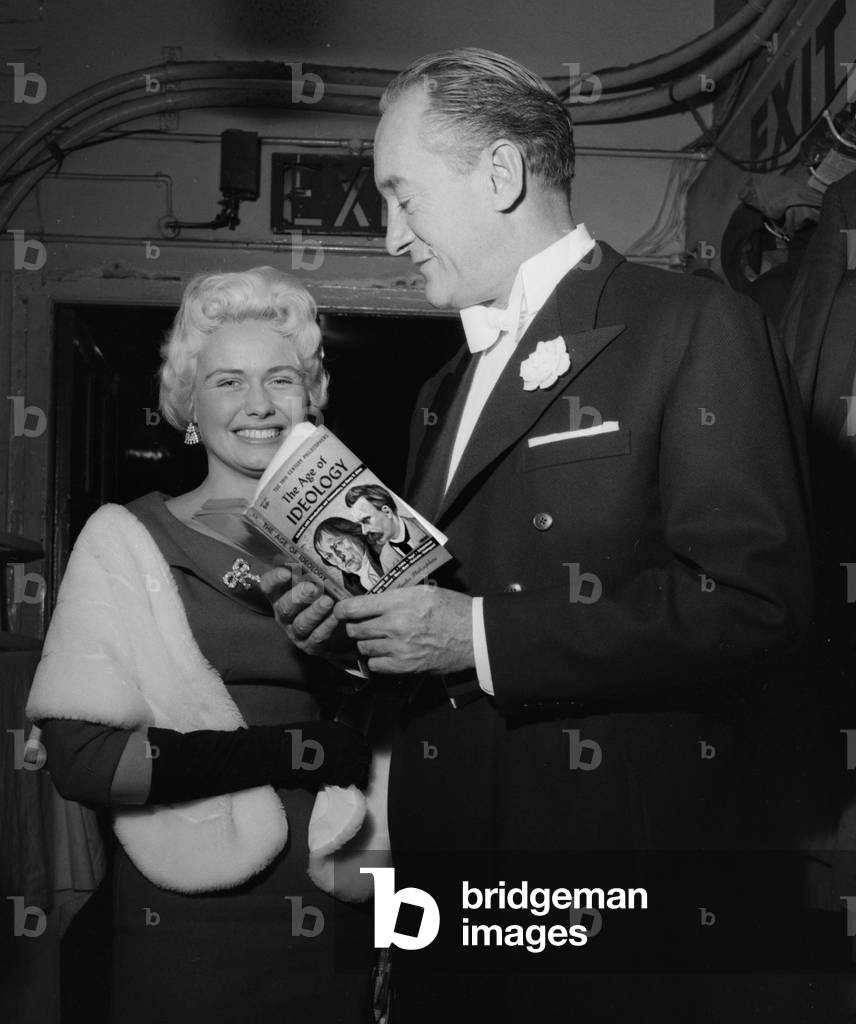 George Sanders expounding Schopenhauer to actress Lili Bergkrona, 1958 (b/w photo)