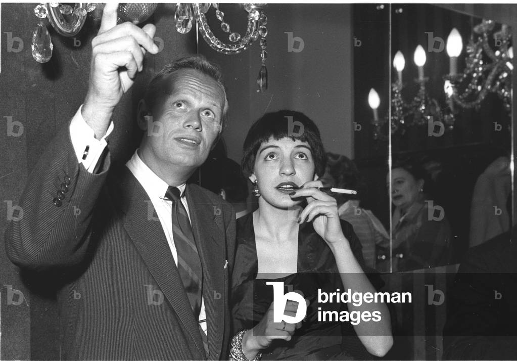 Richard Widmark and American Journalist Sheila Cole, Stork Room, London, UK, 1954 (b/w photo)