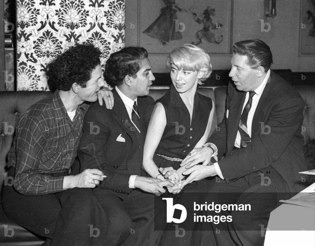 A dishwasher (Tony Panetti), a Maharaja (Cooch-Behar), a dancer (Vicky Martin) and a night club boss (Al Burnett), Stork Room, London, UK, 1953 (b/w photo)