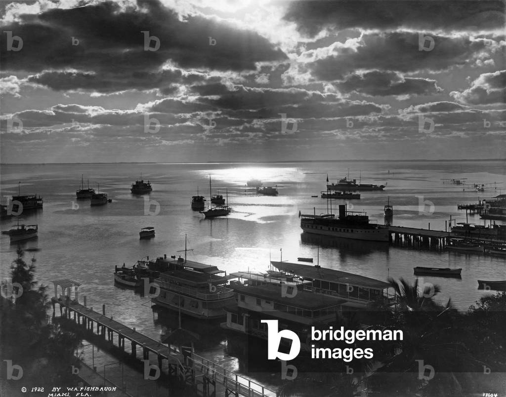 Houseboats and yachts docked at the piers along Biscayne Blvd between NE 1st and 2nd Streets, 1922 (b/w photo)