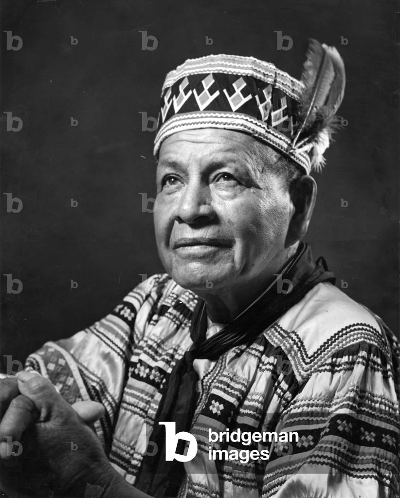 Tribal leader in traditional Seminole clothing, 1961 (b/w photo)