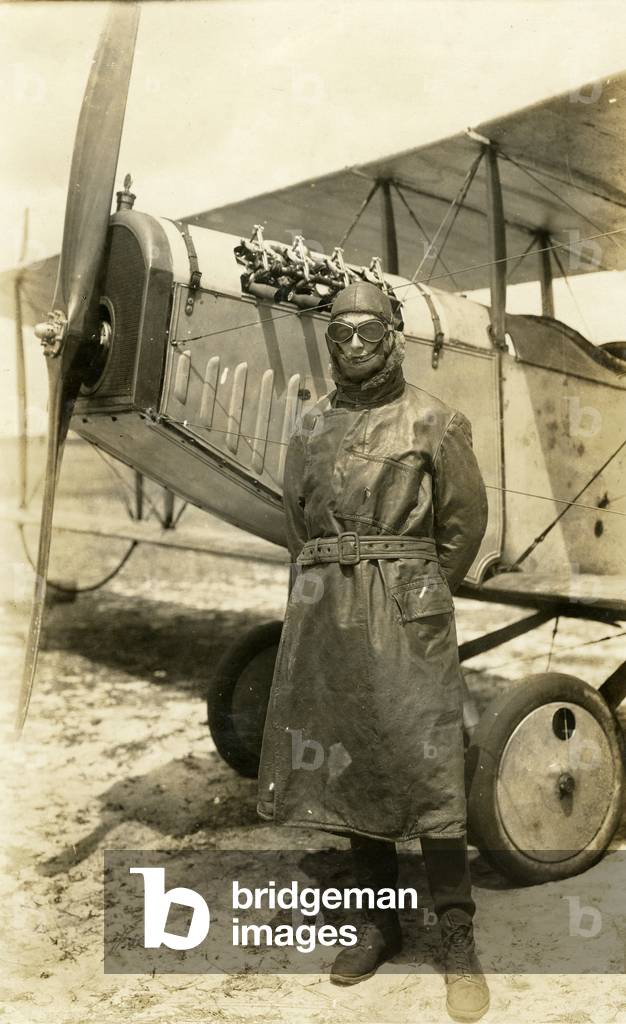 Lieut. W. A. Spratt stands by his biplane at the Curtiss Flying School, c.1918 (b/w photo)
