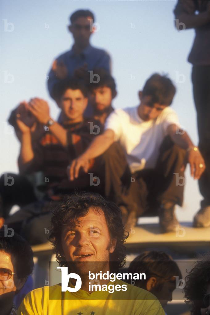 Rome, 1999. Serbian director Emir Kusturica visits the Casilino 700 gipsy camp/Roma, 1999. He registered Emir Kusturica in visita al campo nomadi Casilino 700 -