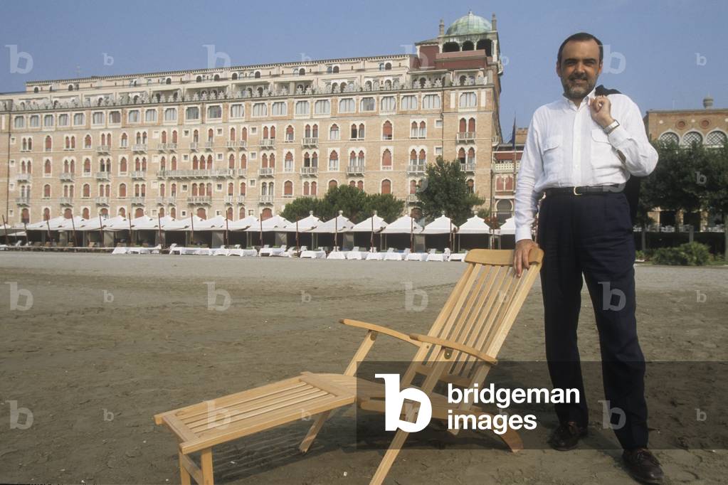 Venice Lido, 1999. Venice Film Festival director Alberto Barbera on the beach in front of Excelsior Hotel (photo)