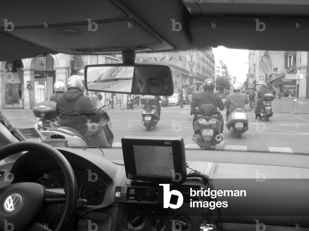 A Paris street view from inside of taxi